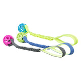 Three elastic dog toys with handles and balls in pink, blue and green. Material: plastic and fabric.
