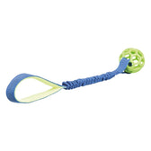 Toy with green plastic ball and elastic blue strap with loop.
