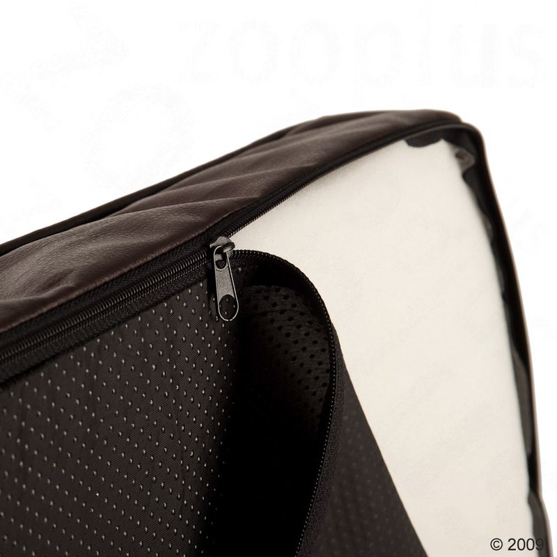 Close-up of a black zip on a padded case with a perforated surface and white interior.