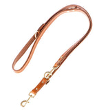 Brown leather dog lead with gold-coloured metal fastenings and adjustable length.