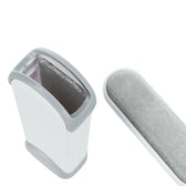 Grey and white lint brush cleaner with removable brush, suitable for removing pet hair.