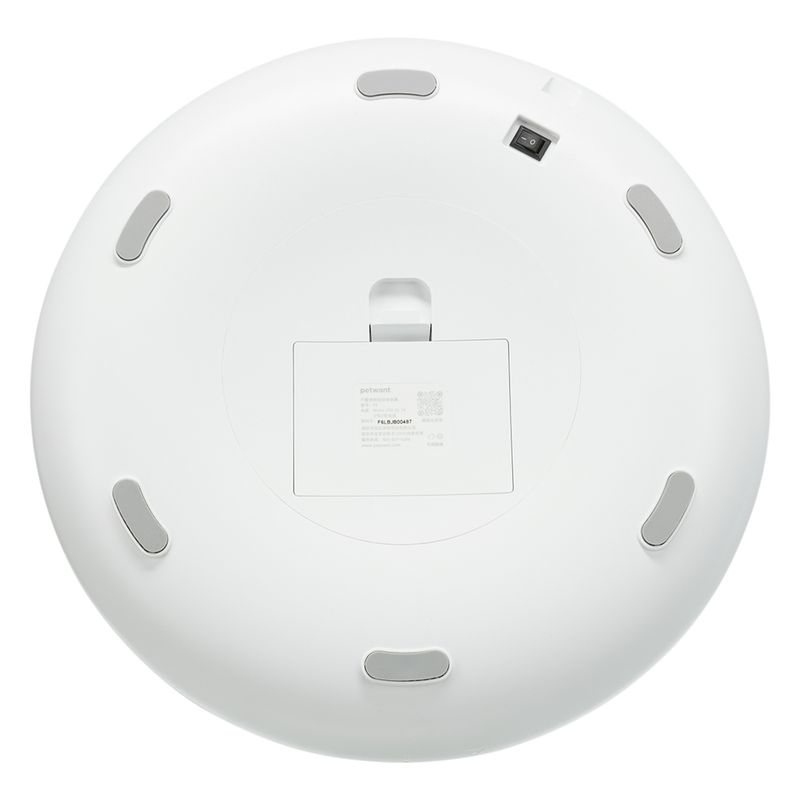 Round white underside of a device with grey feet, QR code and label 'petwant FEL5-80041T'.