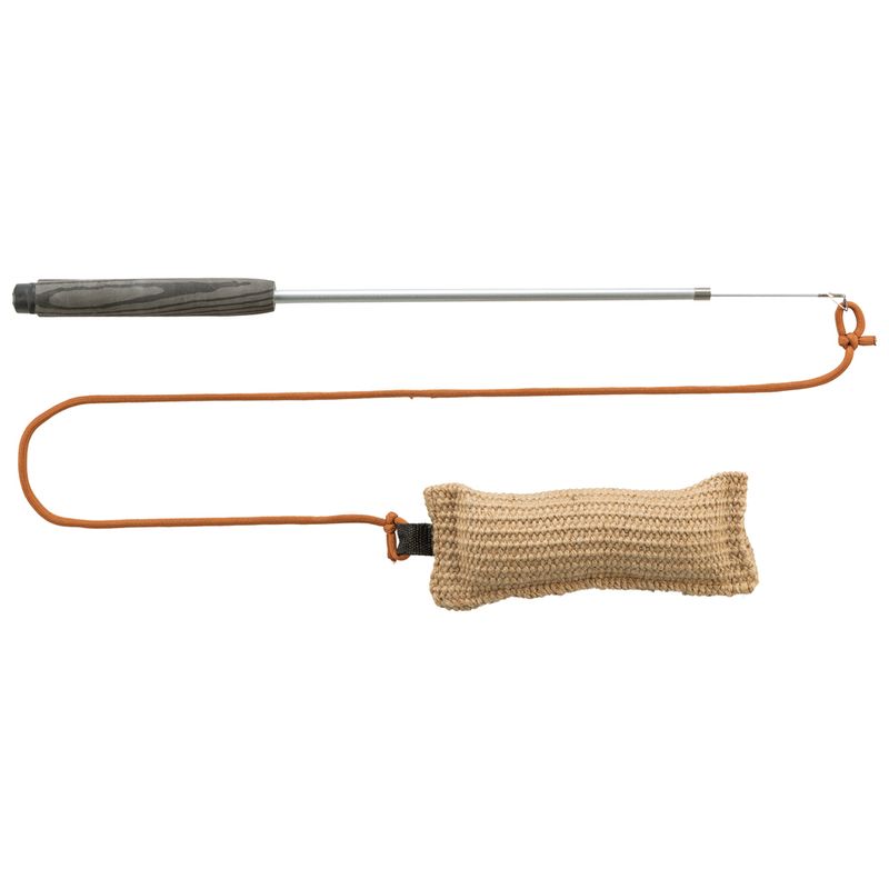 Play wand with wooden handle, metal rod and brown cord, attached to a beige knitted cushion.
