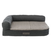 Grey pet bed with soft beige lying surface and raised edge. Label visible: vitalEdition Revive.