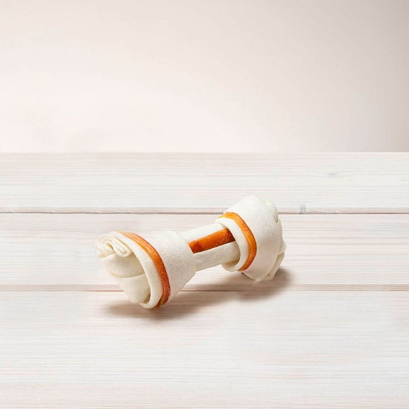 Chew bone made of white material with orange accents, suitable as a dog chew.