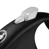 Close-up of a black handle with a silver slider, possibly for a leash or device.