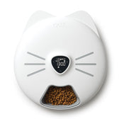 Catit automatic feeder with digital display, shows next feeding time at 13:00. Lower section filled with dry food.