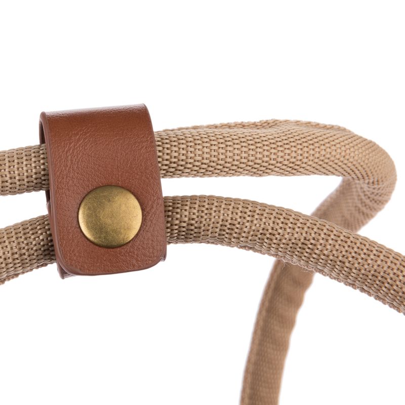 Close-up of a beige braided rope with brown leather holder and gold-coloured metal button.