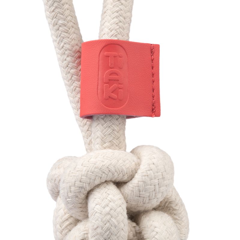Tiaki knot toy made of braided rope with red leather detail.