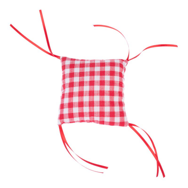 Red and white checked cushion with red ribbons at the corners, suitable for fastening or decorating.