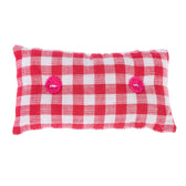 Red and white chequered cushion with two pink buttons, rectangular shape.
