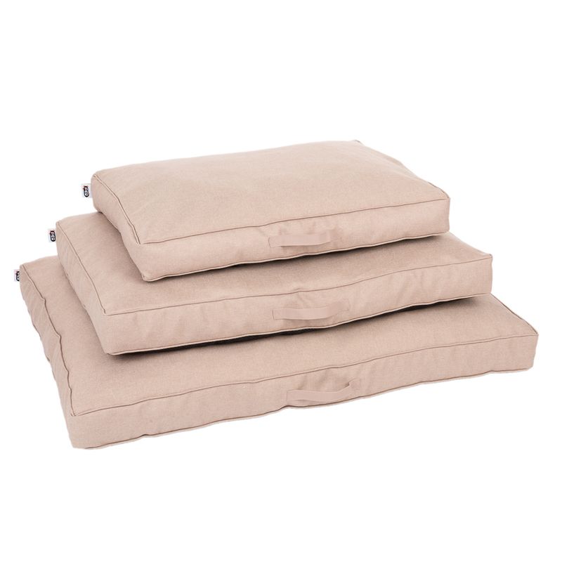 Three beige dog cushions in different sizes, stackable with side carry handles.