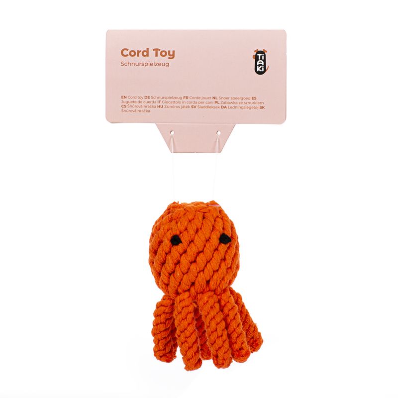 Tiaki Cord Toy, orange rope toy with black face. Packaging shows product name and multilingual description.