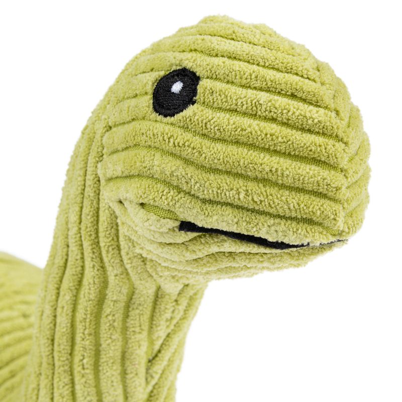 Green plush toy in dinosaur shape with striped texture and embroidered eyes.