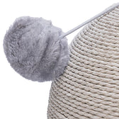 Close-up of a grey plush ball on an elastic cord, attached to a scratching post made of braided rope material.