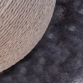 Close-up of a scratching post part with braided rope and soft grey fabric base.