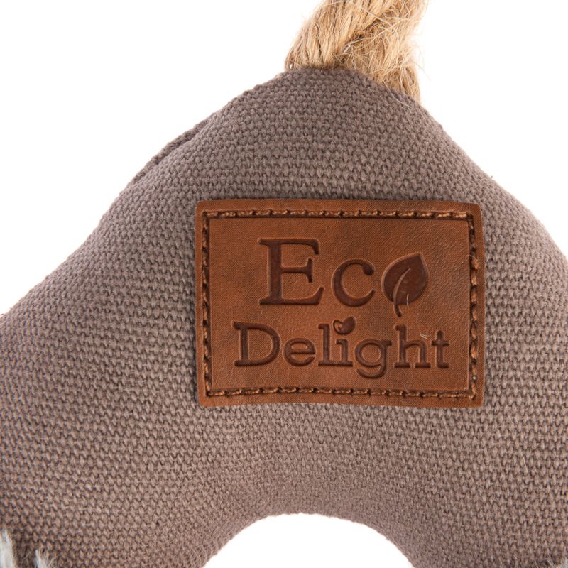 Eco Delight. Brown leather label on grey fabric with leaf motif.