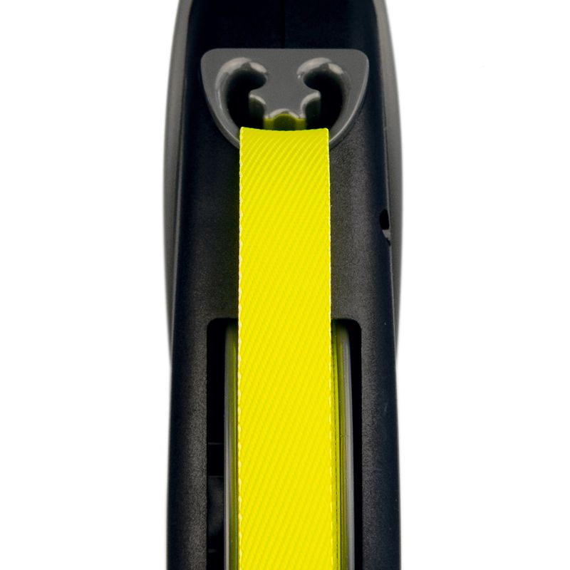 Close-up of a yellow dog lead in a black casing, showing the attachment and guidance of the lead.