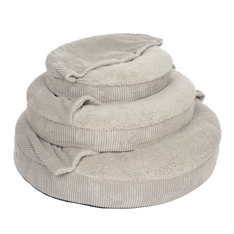Three grey, round pet beds made of soft cord and plush material, stacked in different sizes.