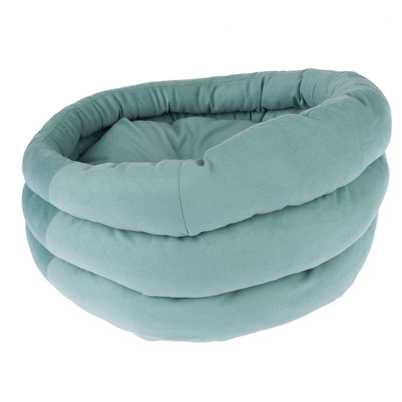 Round, padded pet bed in light green with soft fabric cover and raised edge.