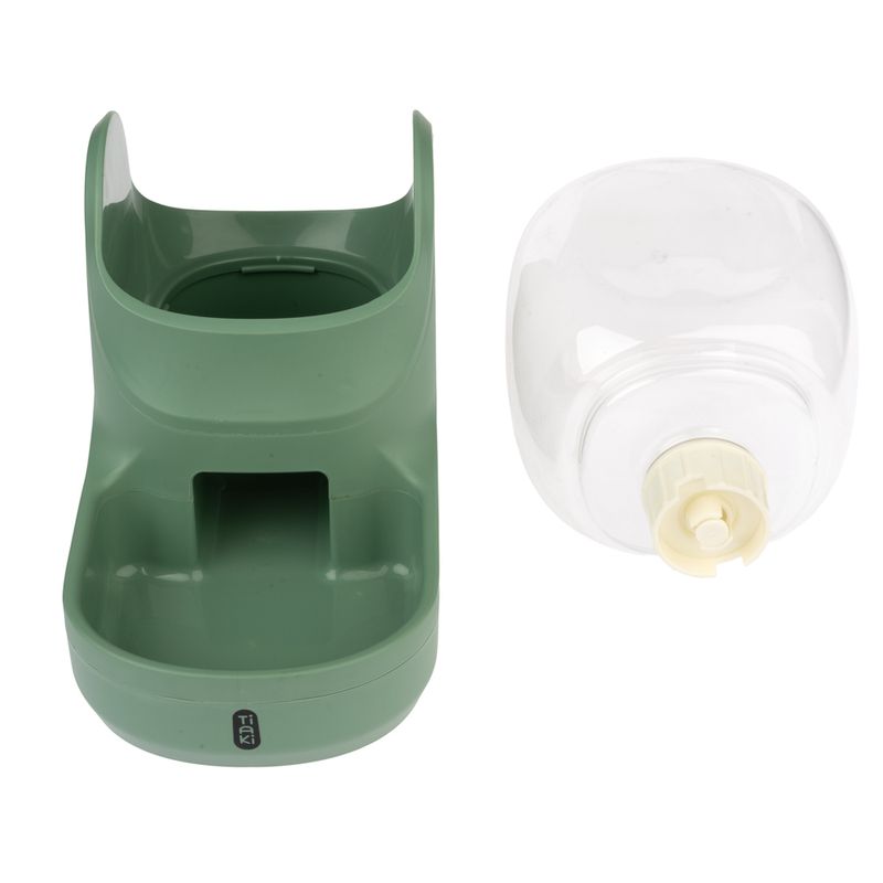 Green food and water dispenser with removable transparent water bottle, brand Tiaki.
