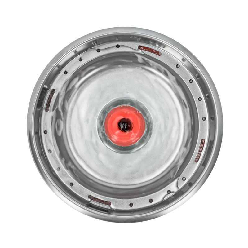 Round stainless steel water bowl with red float in the centre, viewed from above.