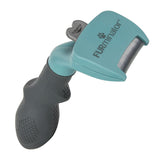 Grooming tool with ergonomic handle and metal comb, labelled Furminator, designed for removing loose hair from pets.