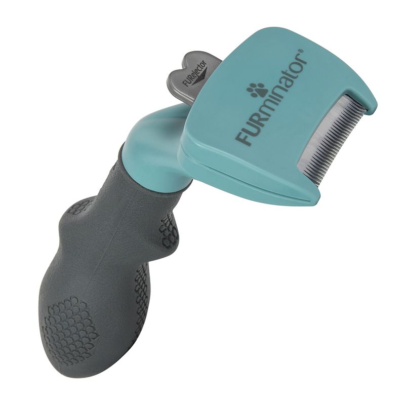 Grooming tool with ergonomic handle and metal comb, labelled Furminator, designed for removing loose hair from pets.