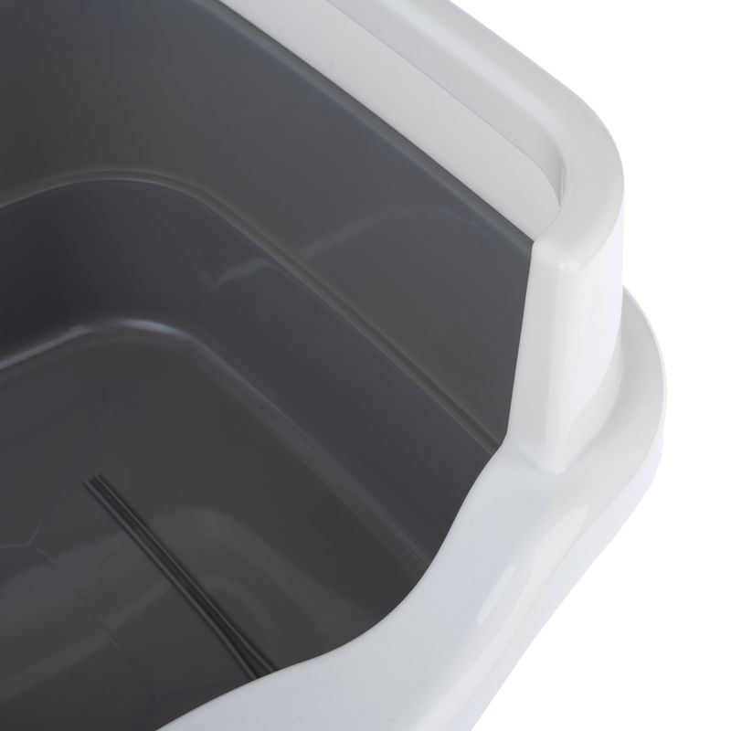 Close-up of a grey plastic tray with a white rim, suitable for pet accessories or cleaning.