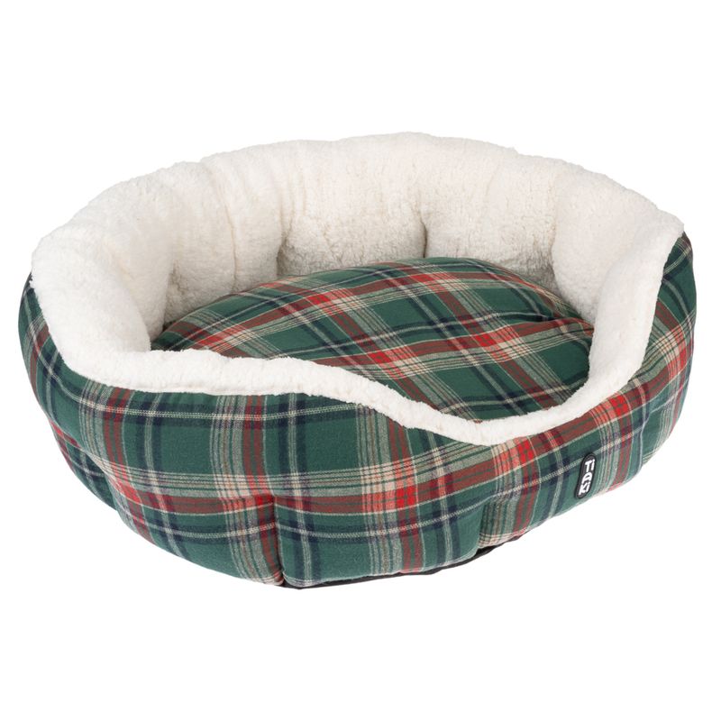 Round pet bed with green-red check pattern and white plush edge. Trixie brand visible on the side.