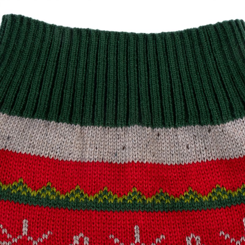 Close-up of knitted material with green, grey and red pattern, suitable for clothing or accessories.