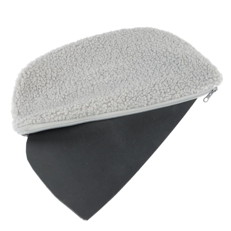 Grey reversible cushion with soft fleece top and black non-slip bottom, visible zip.