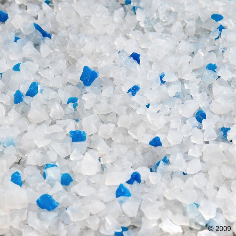 Close-up of white and blue silica litter crystals, suitable for use in cat litter boxes.
