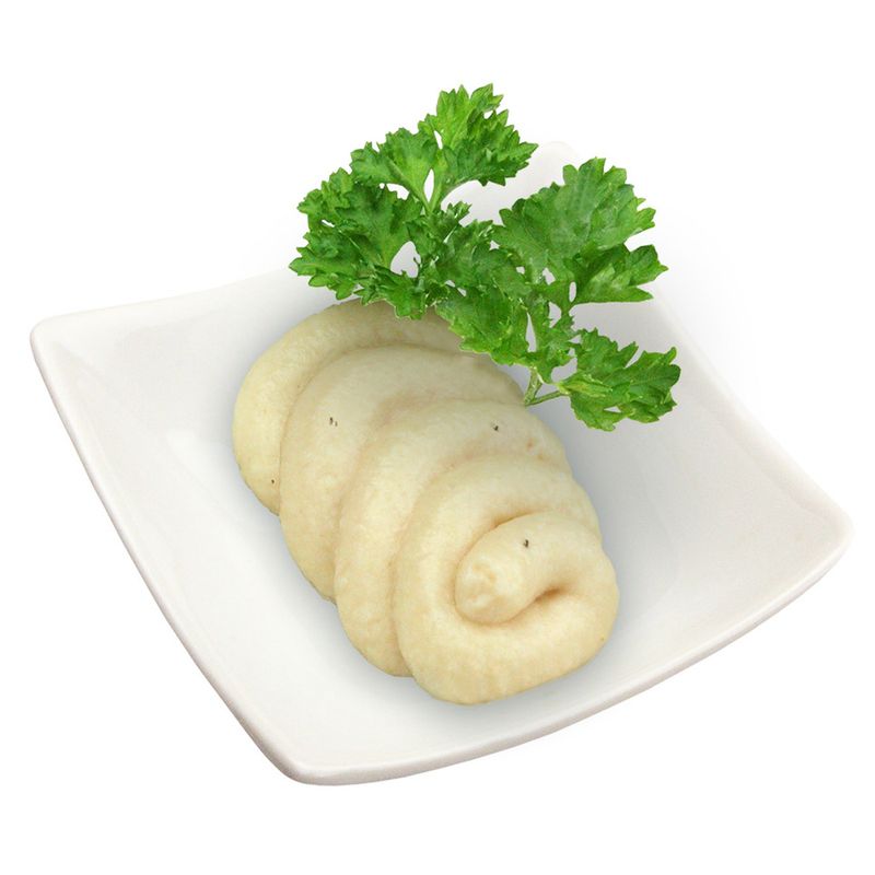White paste arranged in a spiral on a plate, garnished with fresh parsley.