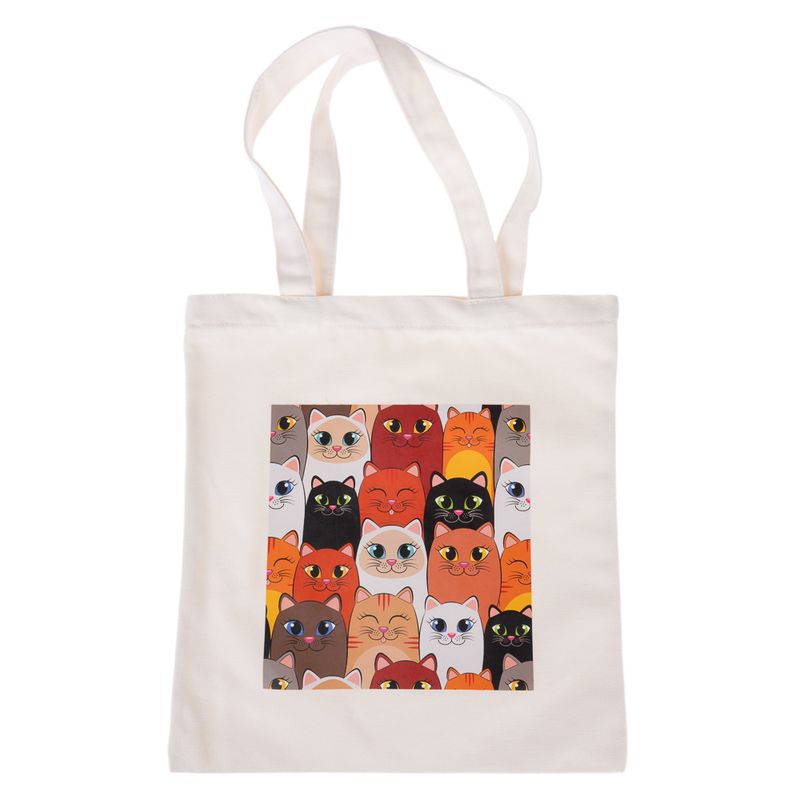 White fabric bag with colourful cat motif, various cats shown in orange, black, white and brown.