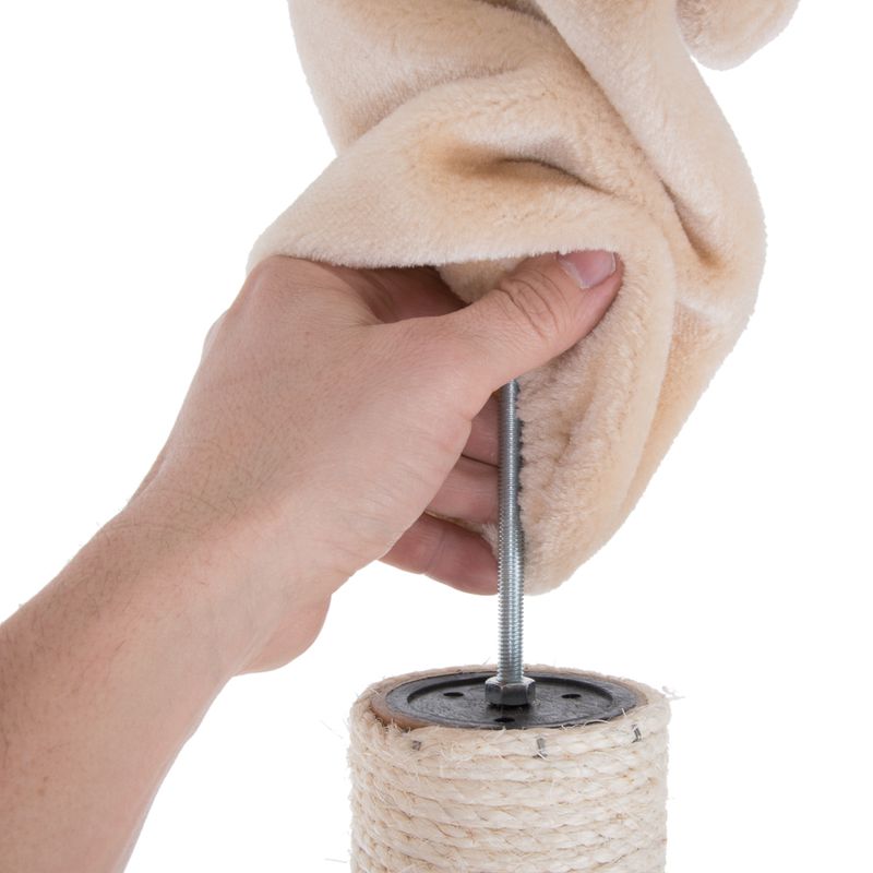 Hand showing assembly of a scratching post element with screw and beige fabric cover.