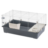 Small animal cage with metal grid walls, grey plastic tray, white food bowl and hay rack. Side clips for attaching the grid visible.