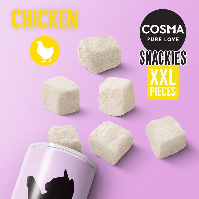 Cosma Pure Love Snackies XXL Pieces, chicken flavour, shown as large cube-shaped treats with packaging on a purple background.