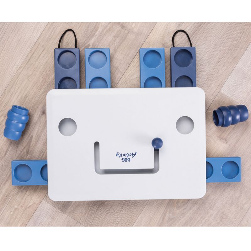 Dog Activity toy with white base and blue elements, suitable for interactive play. Includes movable parts and recesses for placing items.