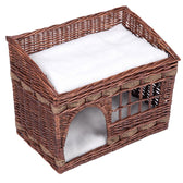Braided basket made of brown rattan with white cushion, two levels and an entrance arch. Suitable as a sleeping place or hideaway for pets.