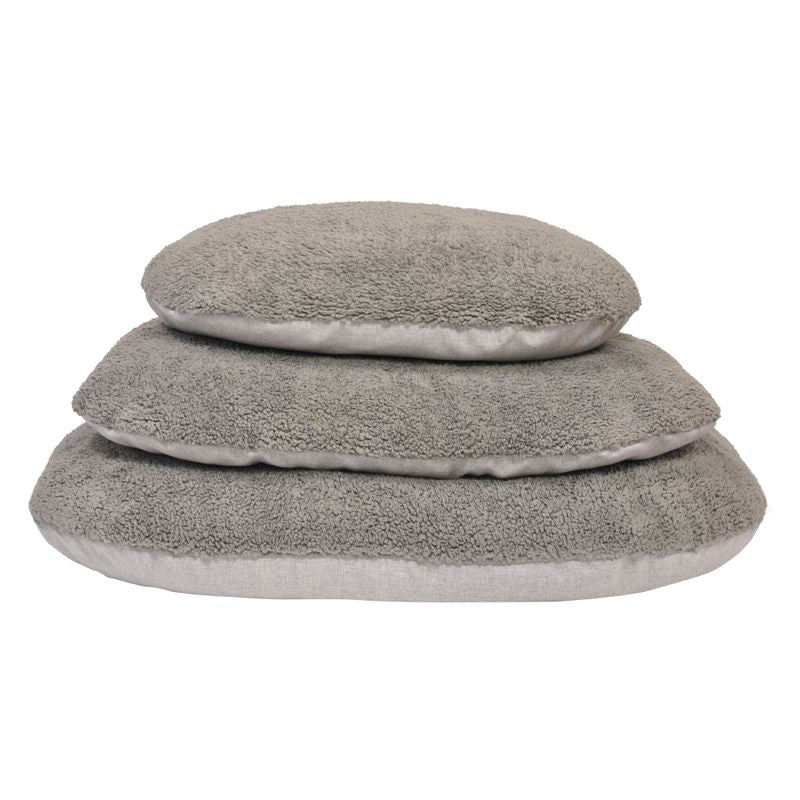 Three grey, fluffy cushions in different sizes stacked on top of each other. Suitable for comfort and relaxation.