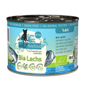 catz finefood Bio salmon, No. 513, no added sugar, no animal testing, DE-ÖKO-006, Norwegian landscape, 97.5% meat content, grain-free, organic certificate visible.