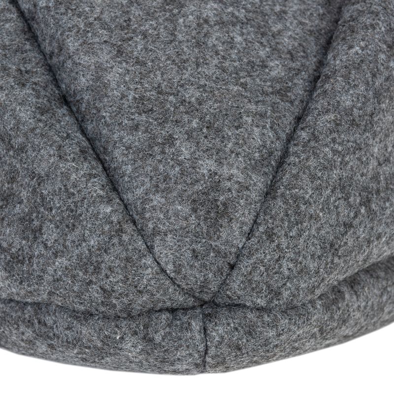 Close-up of grey felt material with visible seams, possibly part of a pet product.
