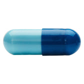 Two-coloured capsule, light blue and dark blue, no visible labelling or further information.