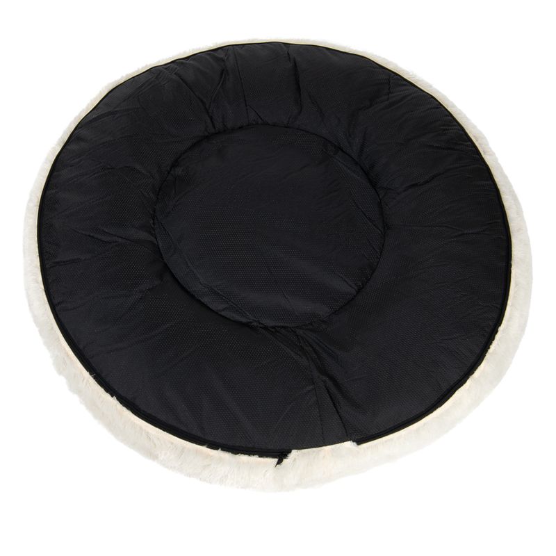 Round black padded mat with a light-coloured edge, shown from above to display its shape and surface texture.