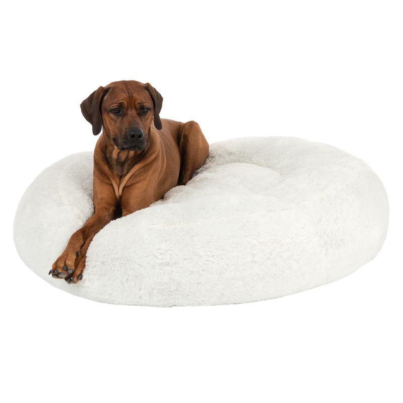 Round, white pet bed with soft plush surface.