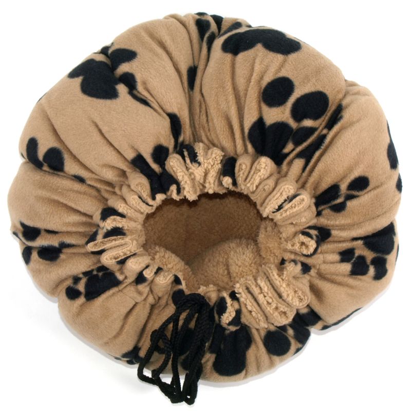Round, beige cuddle nest with black paw patterns and adjustable drawstring. Softly lined inside for comfort.