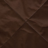 Close-up of brown, durable fabric with cross-stitching. Material details for product description.