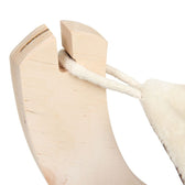 Close-up of a wooden frame with a stretched rope and soft fabric, presumably part of a pet accessory.