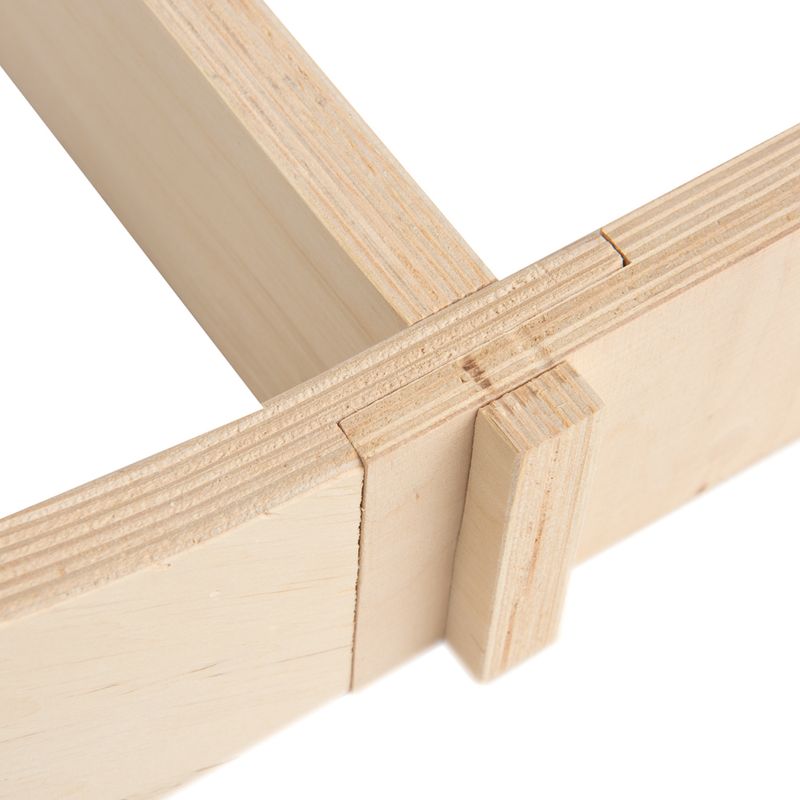 Close-up of a light laminated wood joint, precisely crafted with tongue and groove.